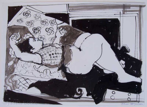 Female reclining on patterned cloth